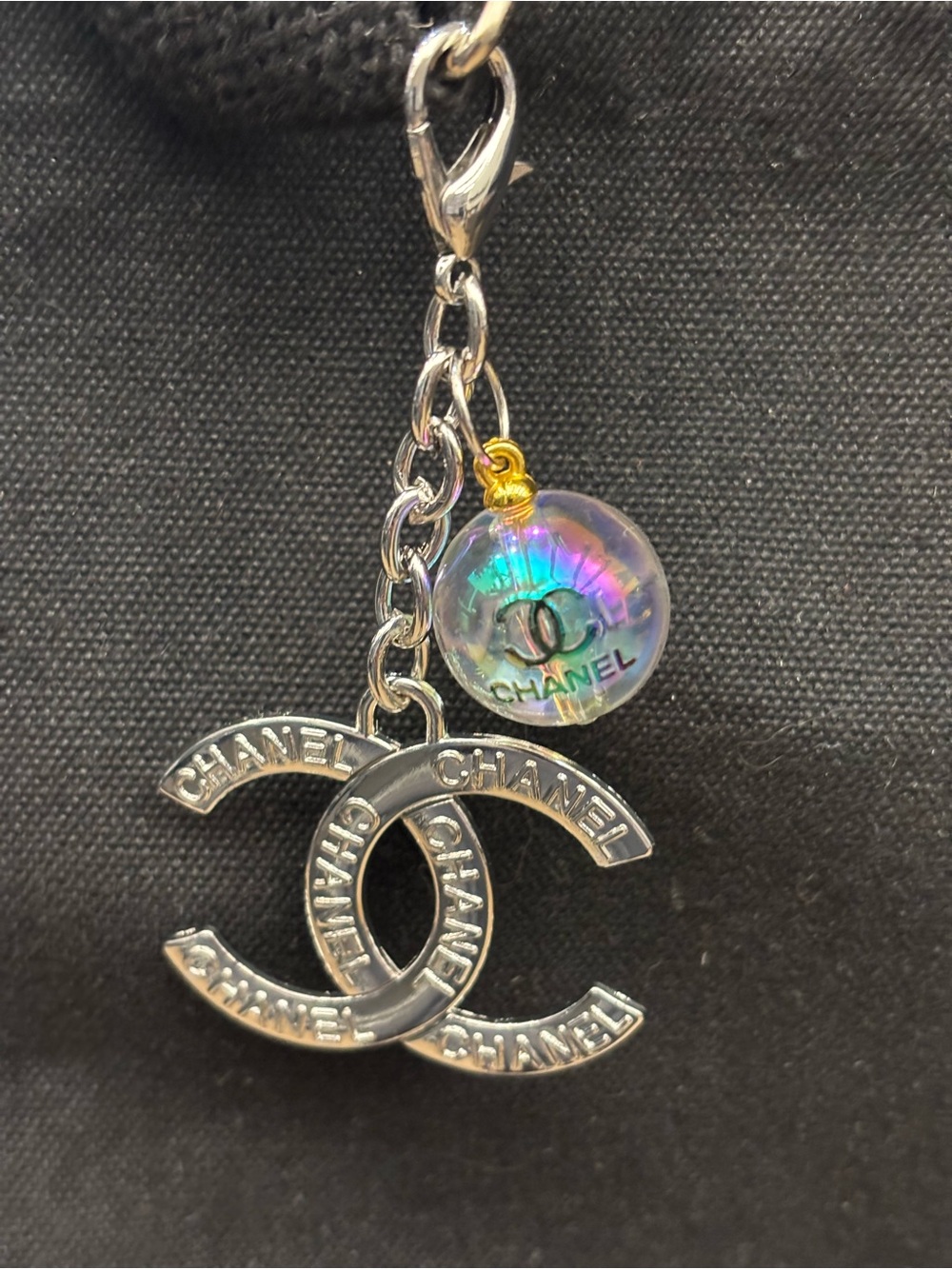 Silver Tone CC interlocking logo bag charm and clear iridescent ball3.5 inches